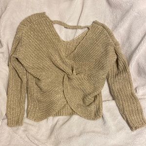 Shirley Lee Sweater with a twist back . Open